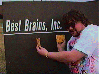 A photo of me with my waffle and my bone in front of the BBI sign.